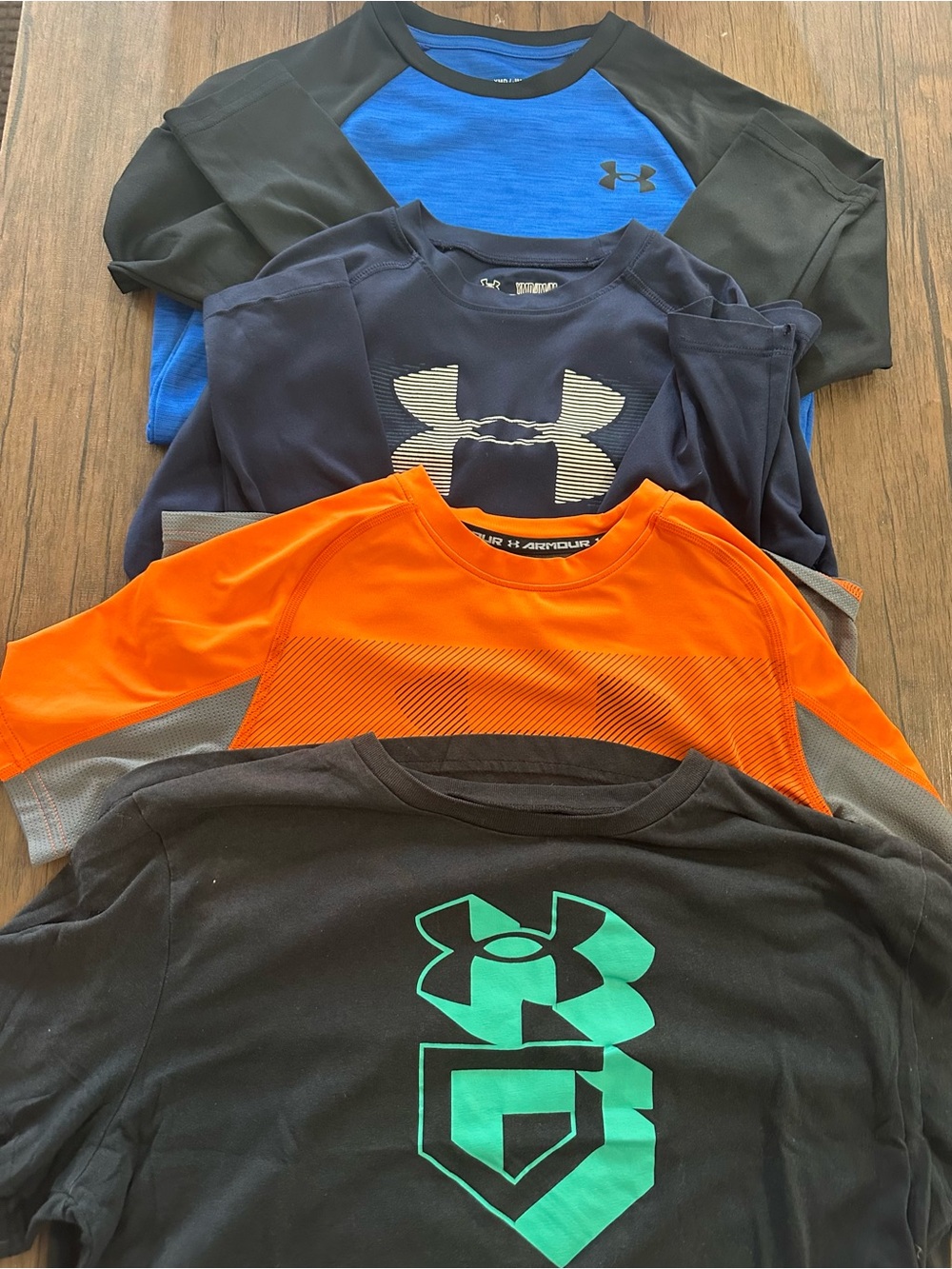 4 boys under Armour shirts